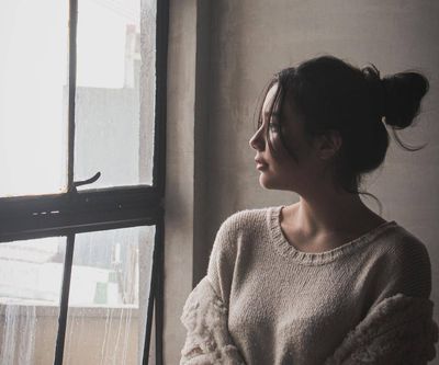 a woman looking out the window